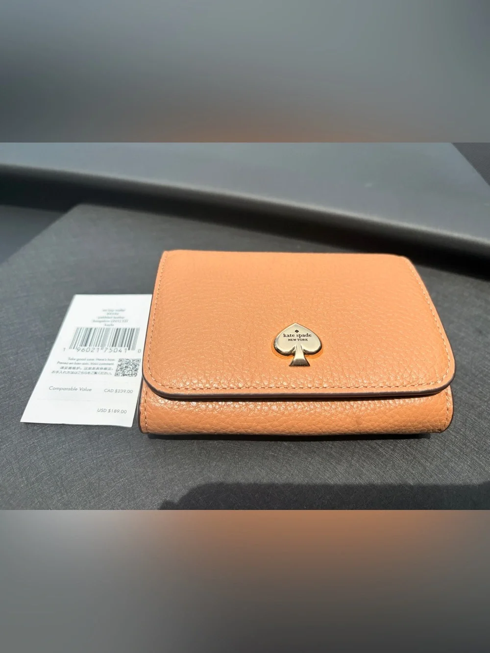 kate spade Peach Pebbled Leather Continental Wallet with Spade Emblem